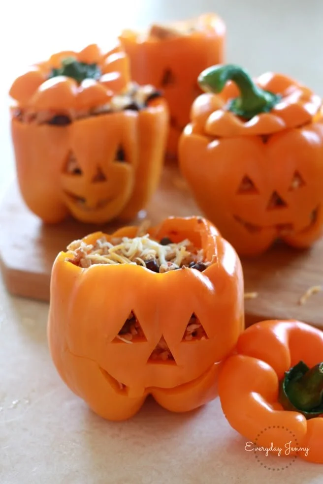Halloween-style stuffed peppers with shredded chicken and rice