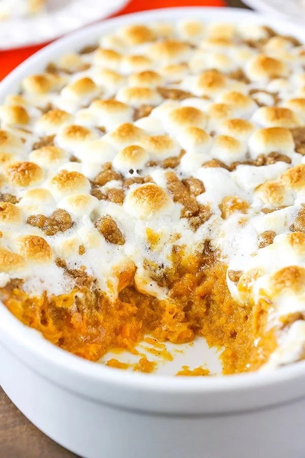 Delicious sweet potato casserole topped with marshmallows and pecans