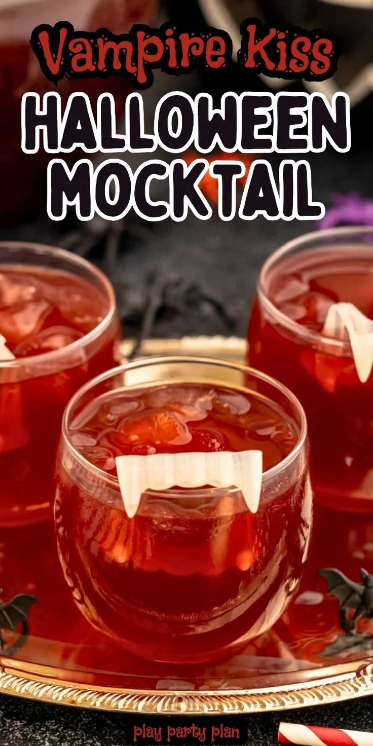 Vampire Kiss Halloween mocktail in a glass with spooky decorations.